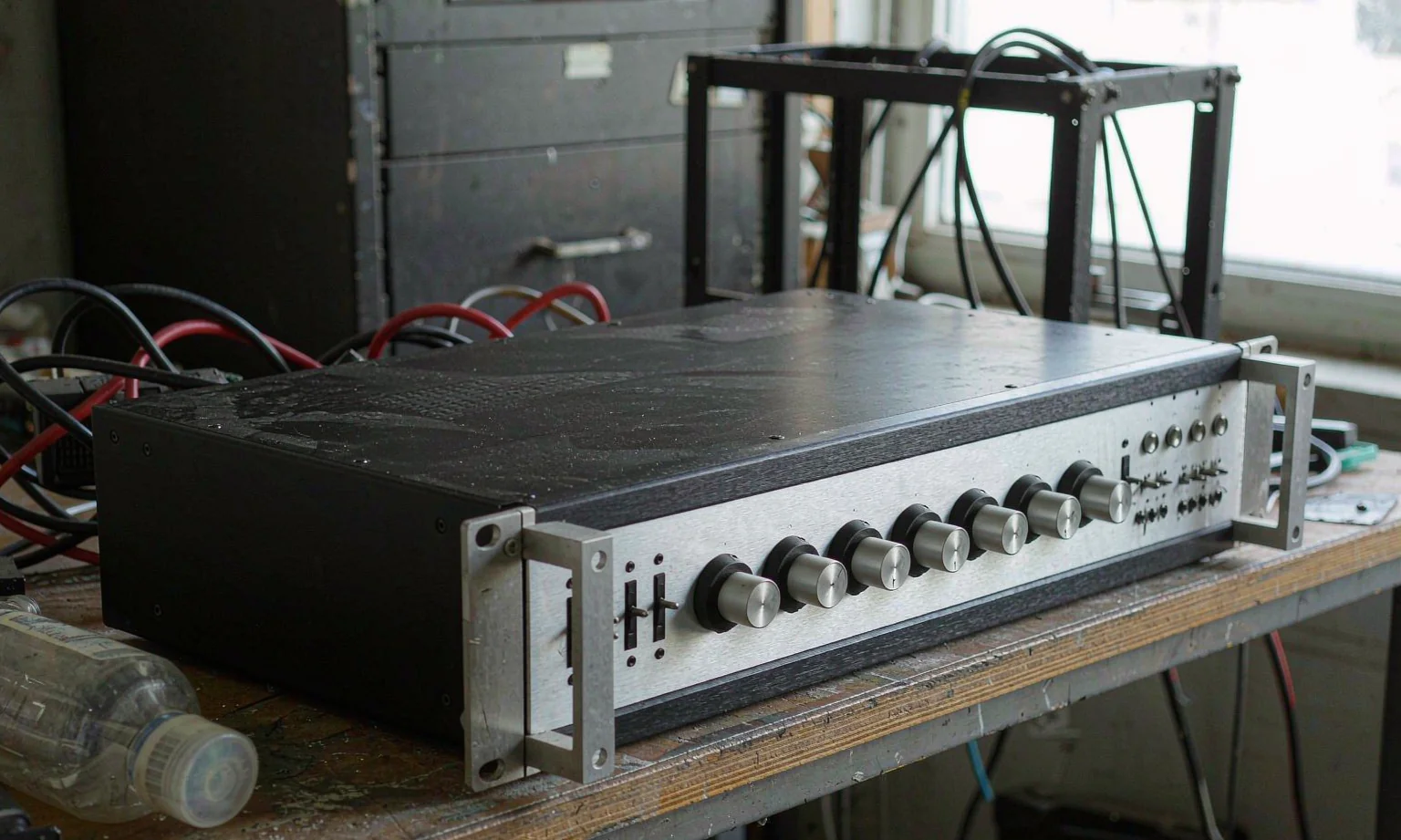Audio amplifier chassis with brushed aluminium front panel and knobs