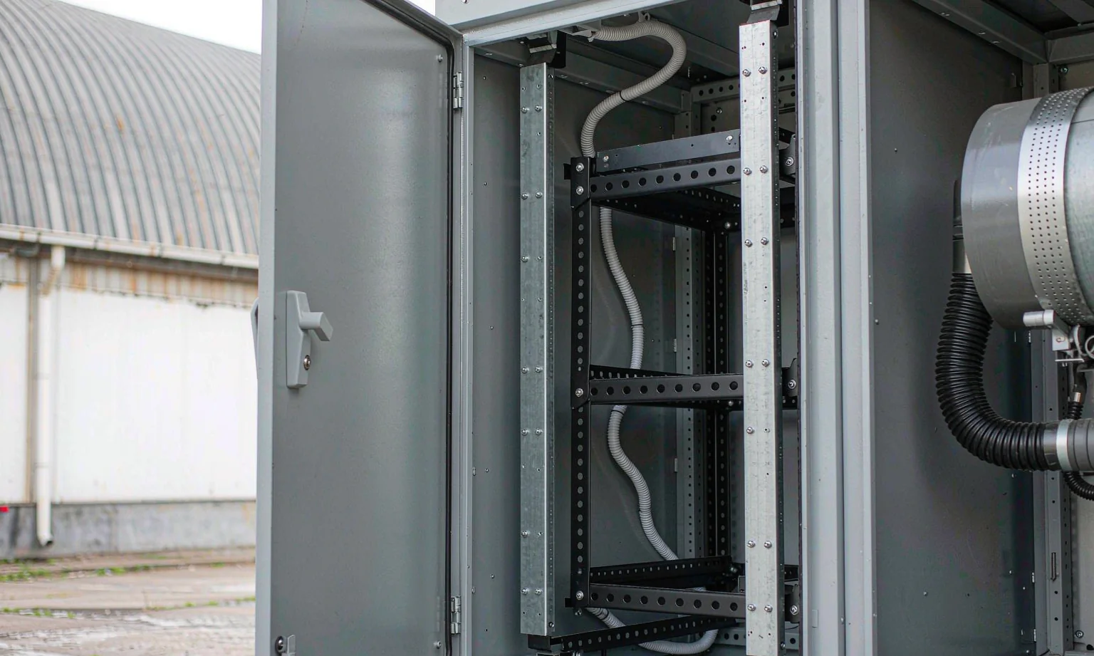 Energy storage cabinet interior with battery module mounting rails
