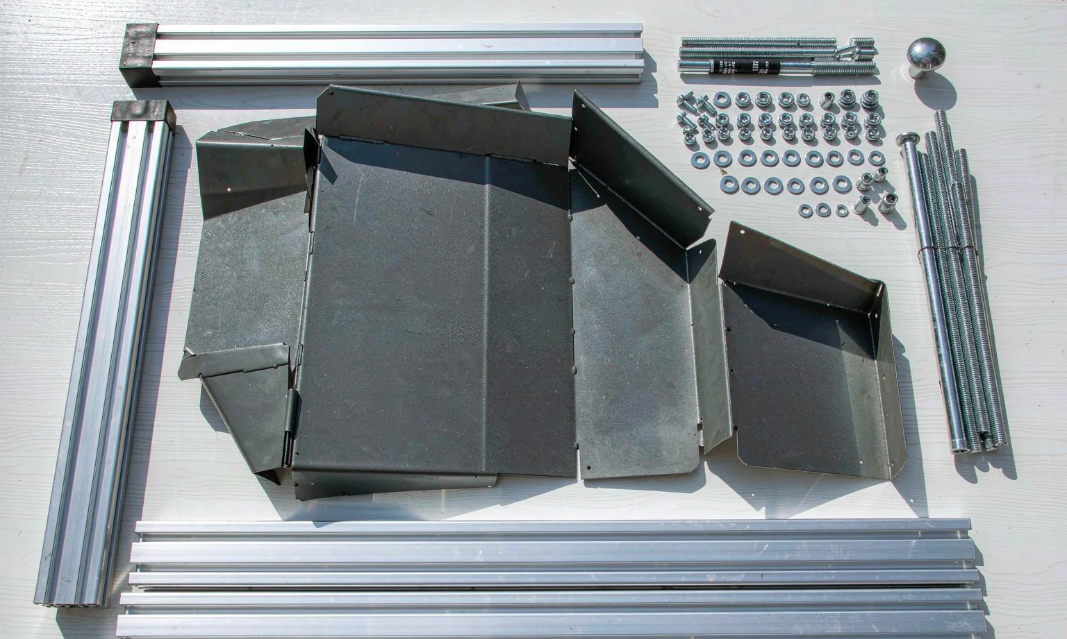 Disassembled instrument case with extruded frame profiles and fasteners