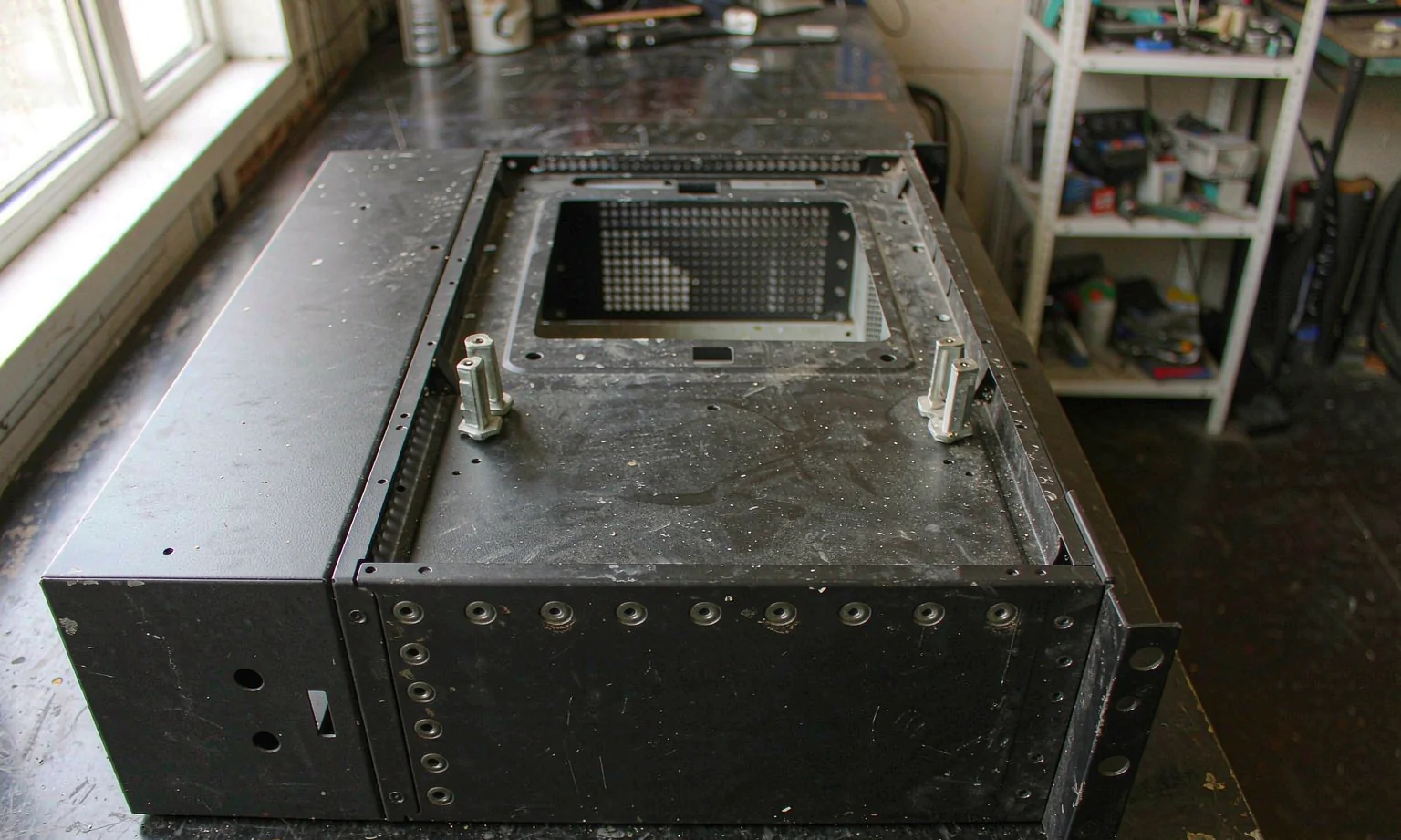 Open industrial PC chassis showing removable motherboard tray