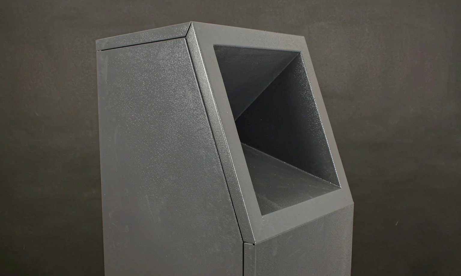 Kiosk enclosure with angled touchscreen bezel and recessed cutout
