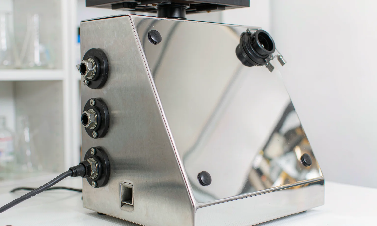Polished stainless steel laboratory instrument casing