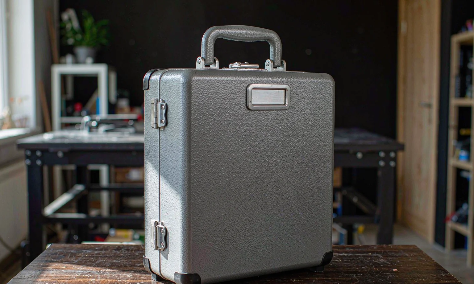 Portable steel instrument case with folding carry handle