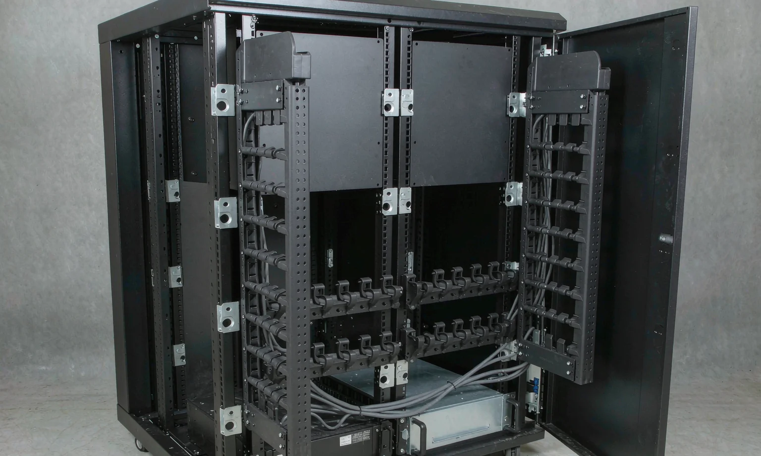 Server cabinet with vertical cable management and lacing bars