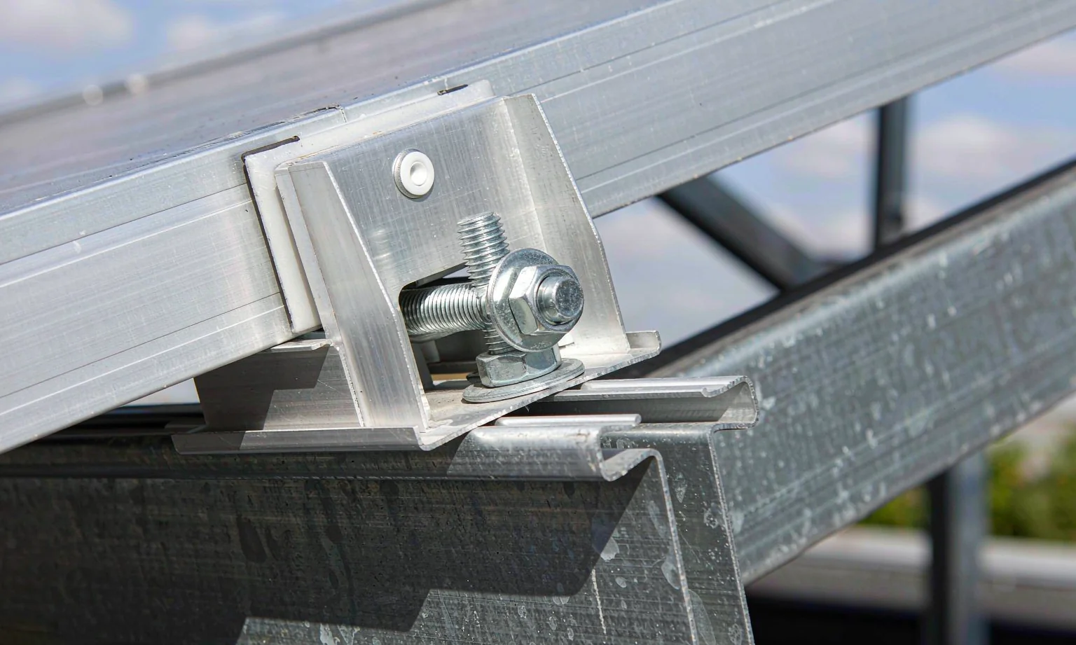 Aluminium solar panel mid clamps and T-bolts on a mounting rail